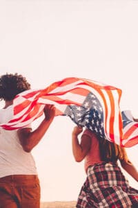 Family with flag - Vanderwall Immigration